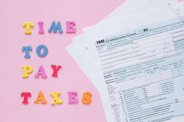 Times to Pay Taxes Sign by Documents